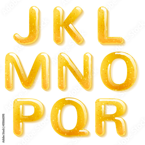 Yellow honey jelly alphabet. Glossy letters.