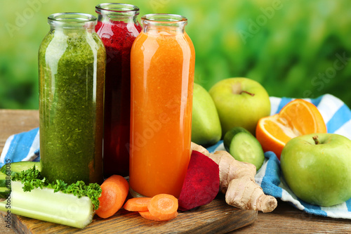 Assortment of healthy fresh juices in glass bottles