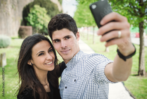 Young couple taking a selfie outdoors