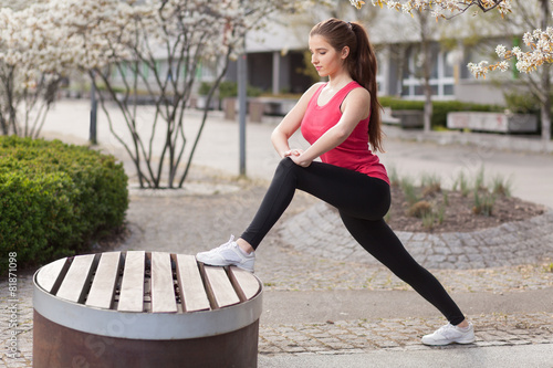 Young beautiful woman running in the city