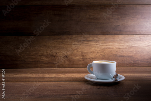 Cup of cappuccino on a wood background