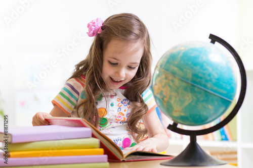 little girl reading book