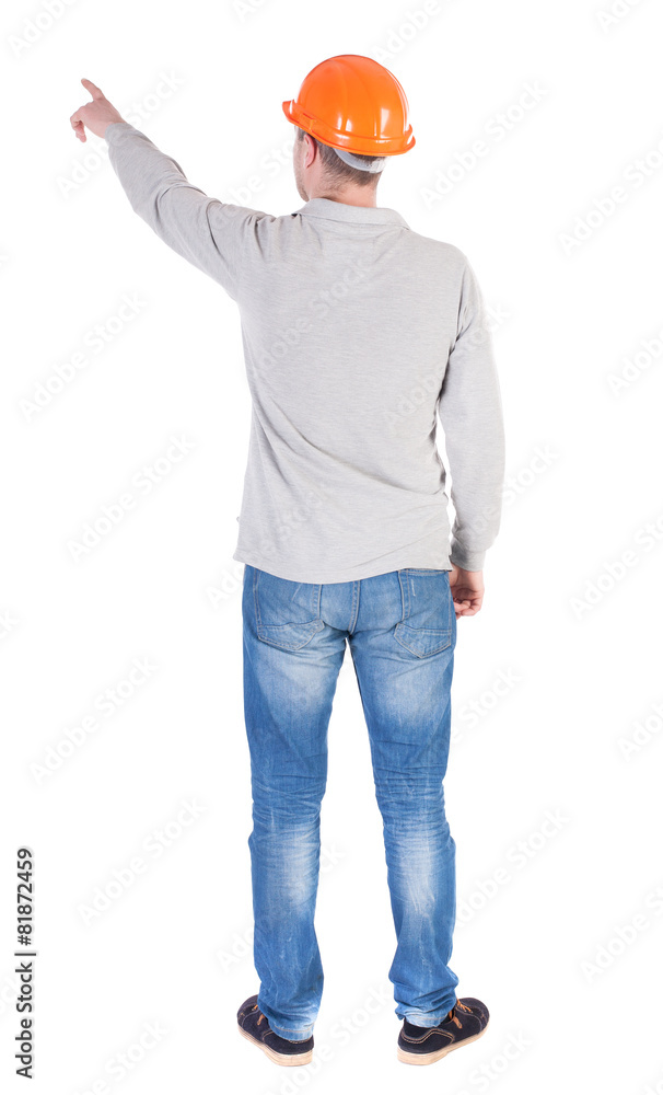Back view of pointing young men in shirt and helmet. Back view of pointing young men in shirt and helmet.