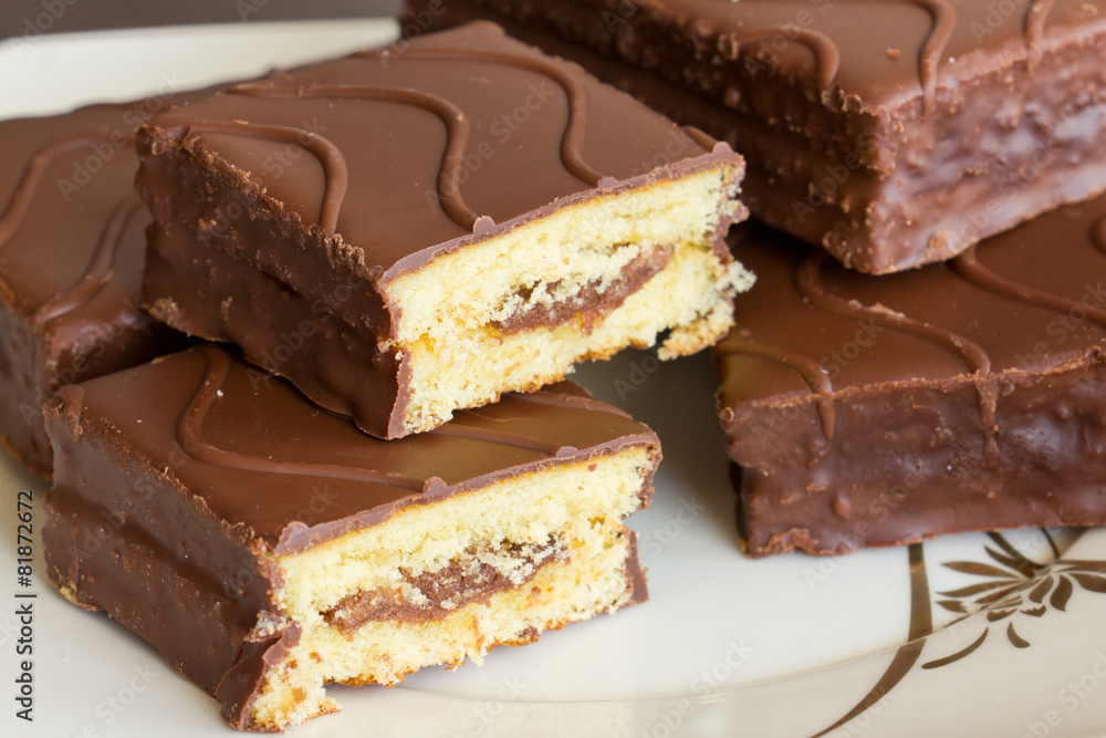 Sliced sponge cake in chocolate Sliced sponge cake in chocolate