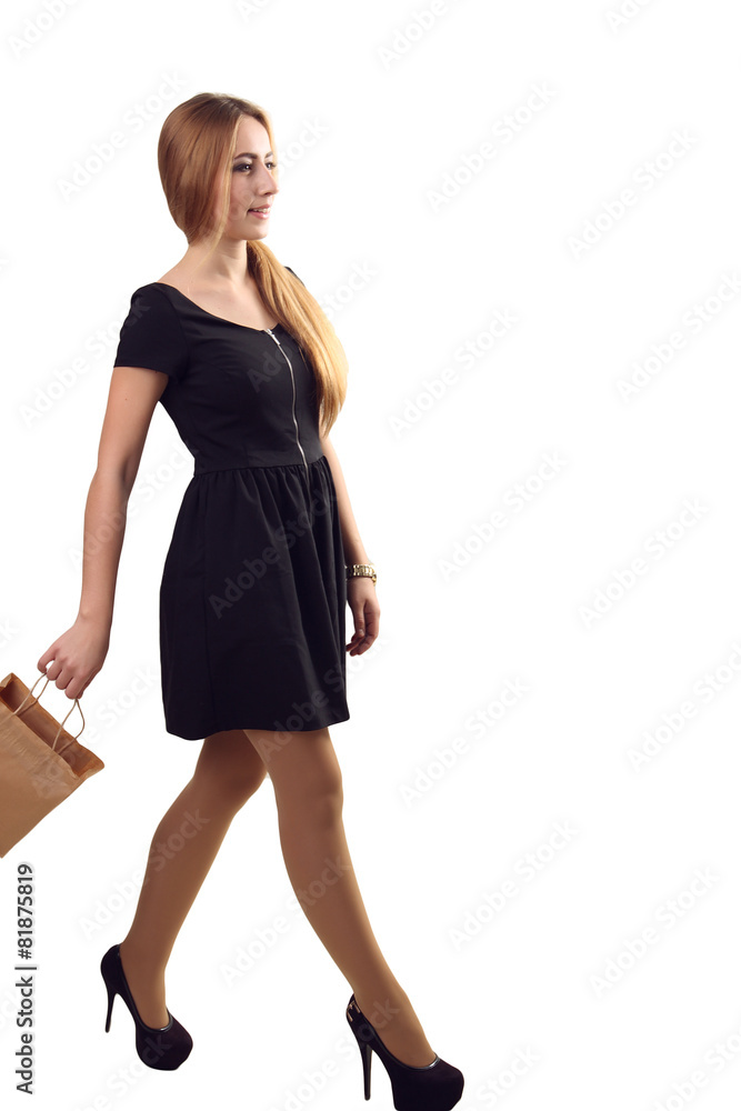 Shopping woman holding bags, isolated on white studio background Shopping woman holding bags, isolated on white studio background