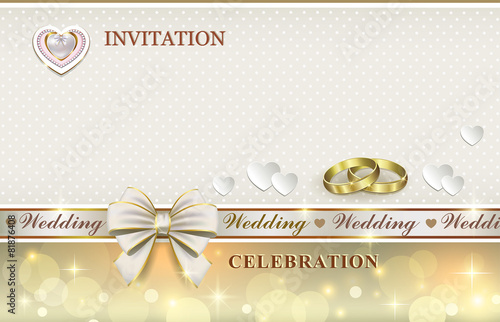 wedding card with rings and hearts
