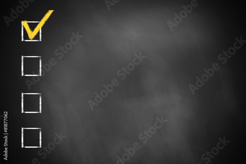 four checkboxes on a black chalkboard