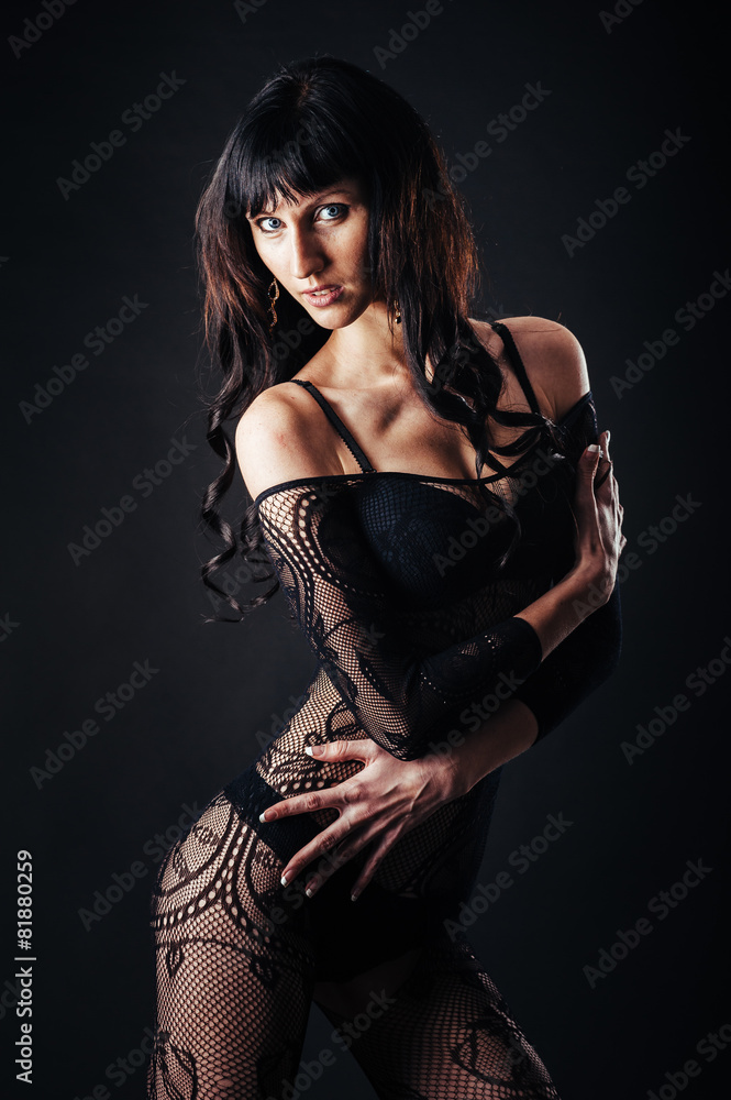 Sexy beautiful naked woman in black erotic lingerie on dark Sexy beautiful naked woman in black erotic lingerie on dark