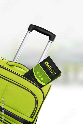 Kentucky. Green suitcase with guidebook.