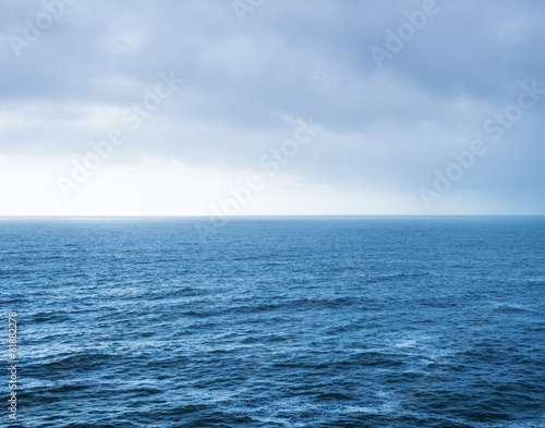 Blue sea landscape and overcast sky
