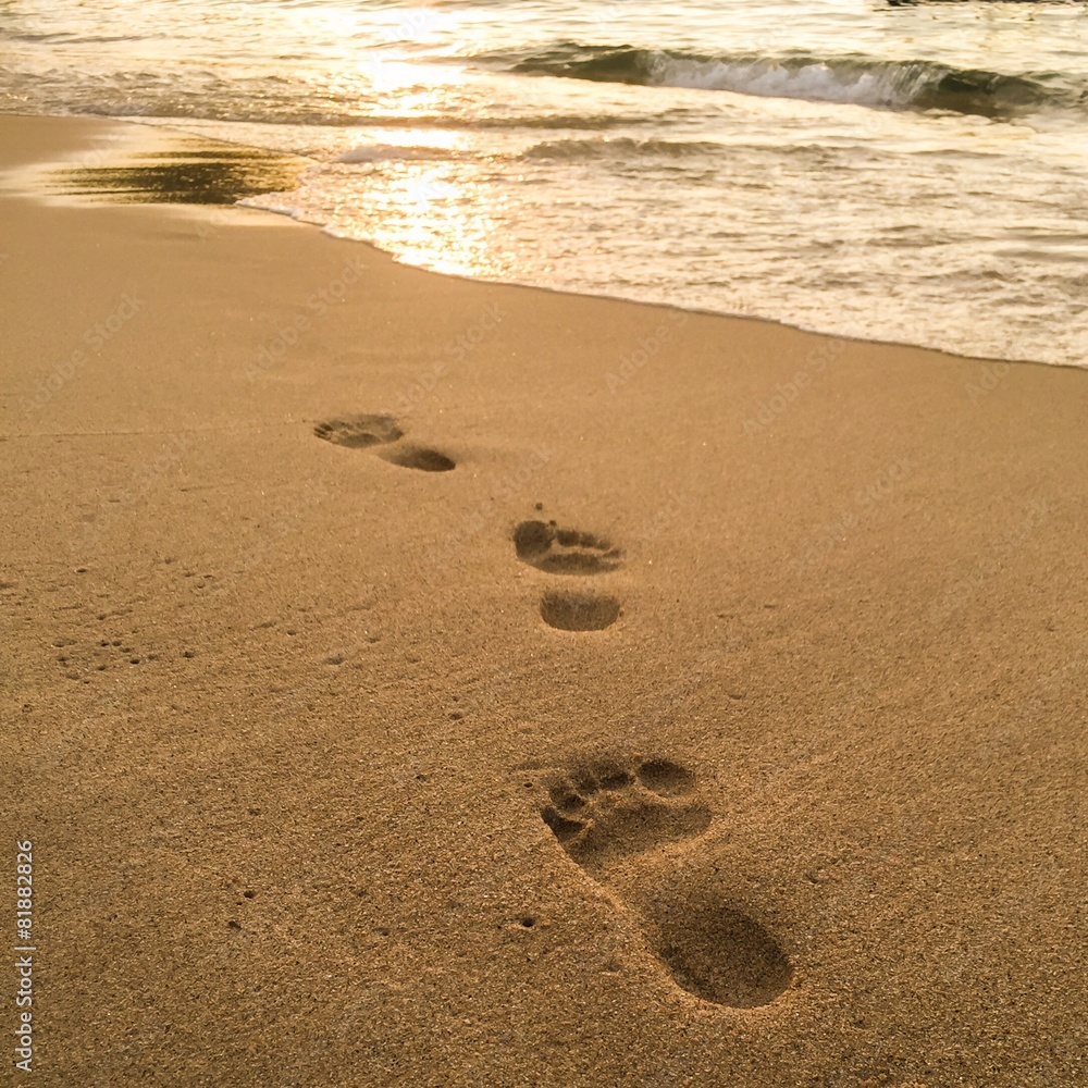 Footprints on the sand beach on tropical island Footprints on the sand beach on tropical island