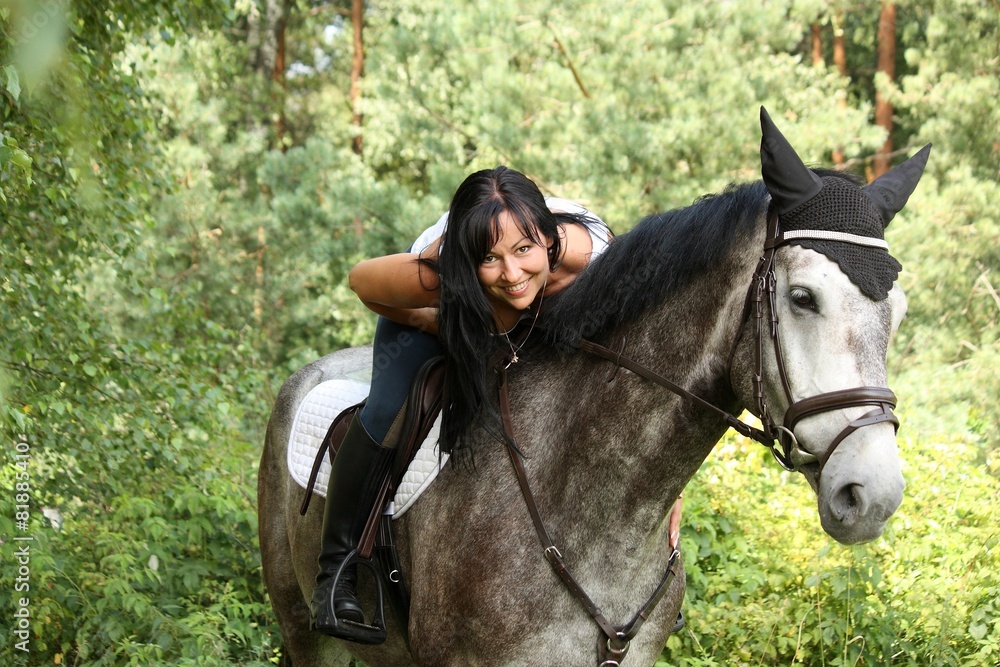 Beautiful woman and gray horse portrait in garden Beautiful woman and gray horse portrait in garden