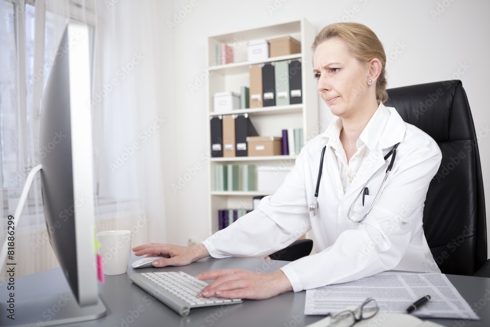 Female Doctor Accessing Information Through Online Female Doctor Accessing Information Through Online