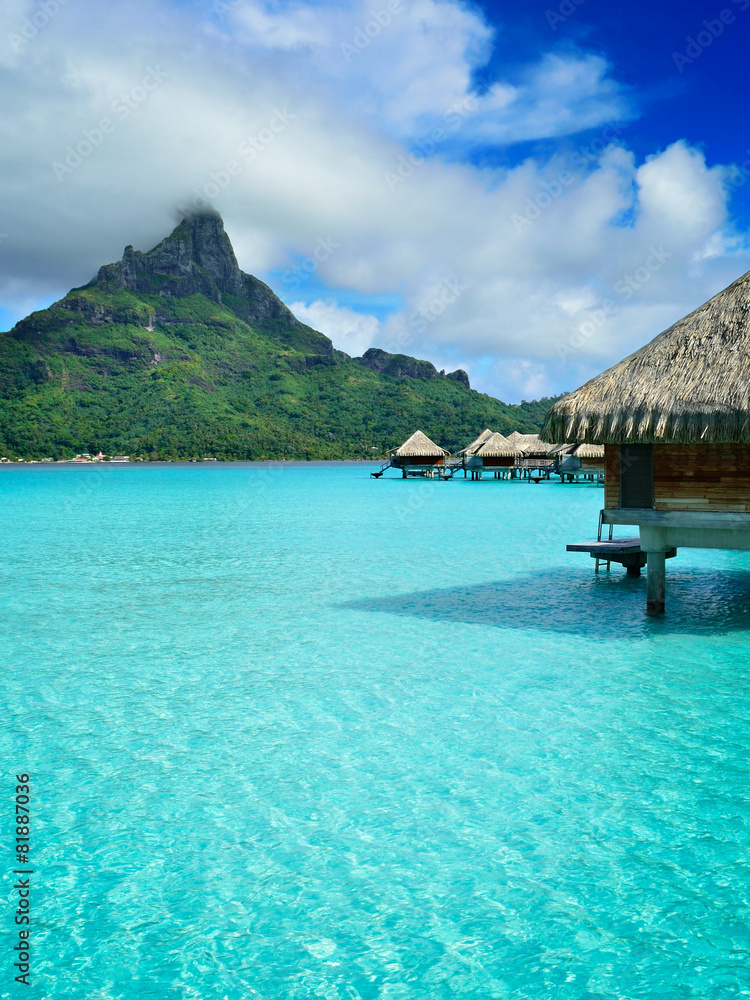 Luxury overwater vacation resort on Bora Bora - obrazy, fototapety, plakaty 