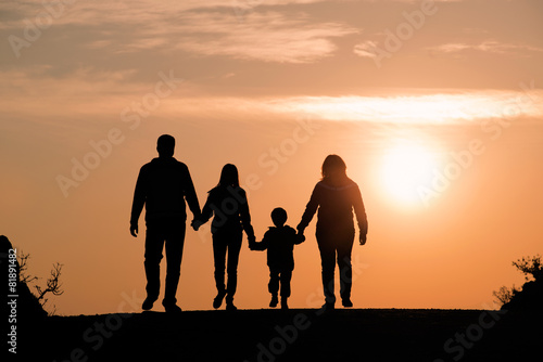 silhouette of family on the outdoor at dusk.