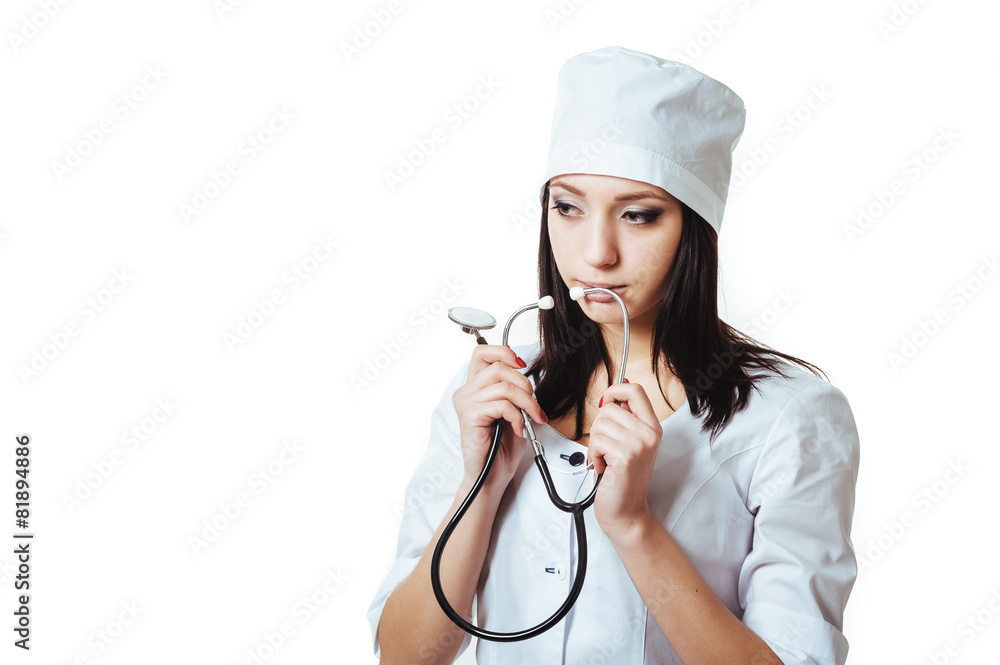Female doctor with stethoscope, standing isolated on white Female doctor with stethoscope, standing isolated on white