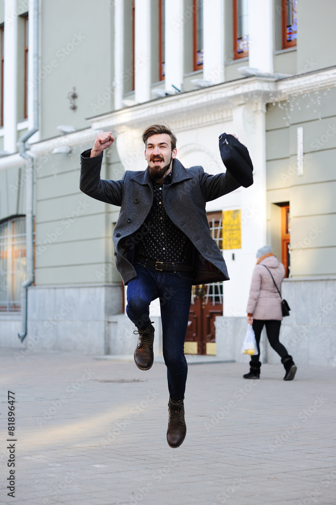 Obraz premium man jumping for joy.