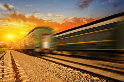 Cargo train platform at sunset with container