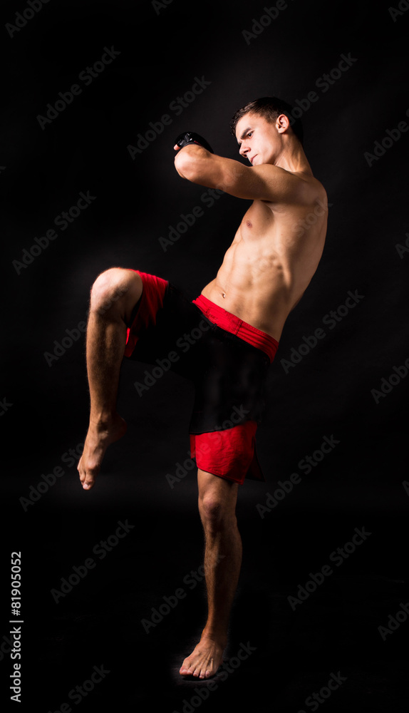Portrait of boxer posing studio in gloves. Portrait of boxer posing studio in gloves.