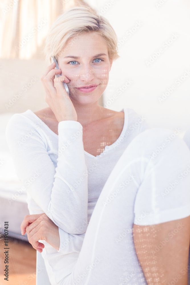 Smiling blonde woman calling on the phone Smiling blonde woman calling on the phone