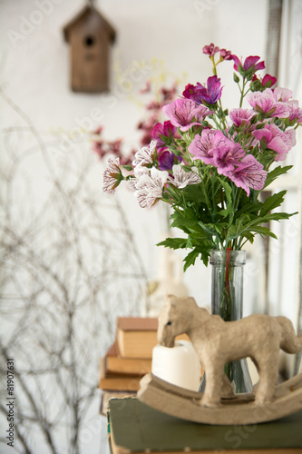 Designer composition with artificial flowers.