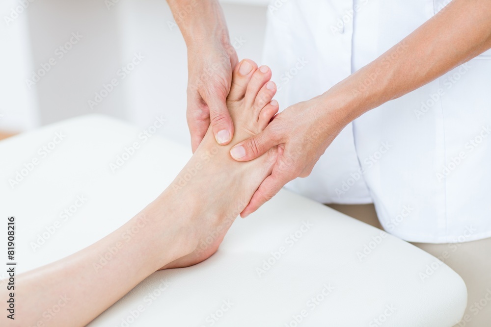 Fototapeta premium Physiotherapist doing foot massage