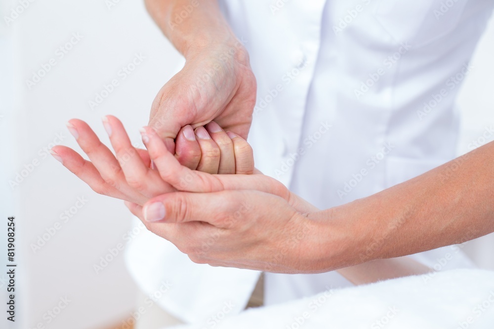 Physiotherapist doing hand massage Physiotherapist doing hand massage