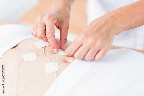 Woman having electrotherapy photo