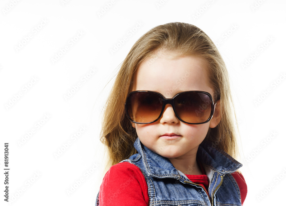 Cute little girl posing in mother's sunglasses, childhood concep Cute little girl posing in mother's sunglasses, childhood concep