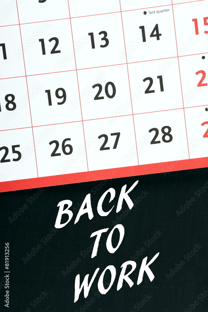 Back To Work reminder on a blackboard with calendar Back To Work reminder on a blackboard with calendar