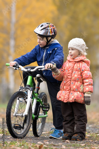 boy on the bike with his sister