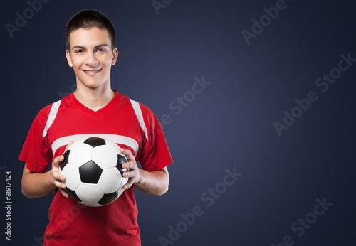 Soccer. Young soccer player with ball in front of white © BillionPhotos.com