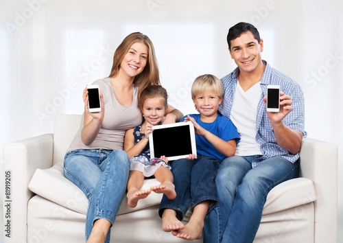 Phone. Family, child, technology and home concept - smiling