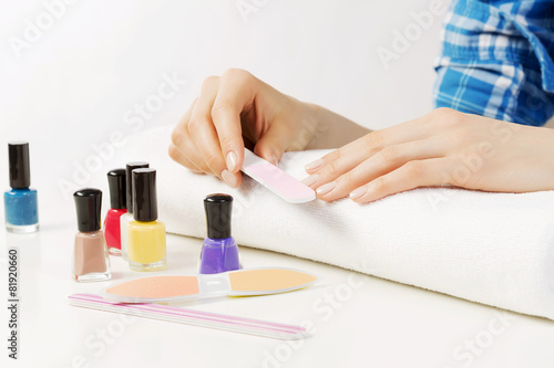 Woman applying polish
