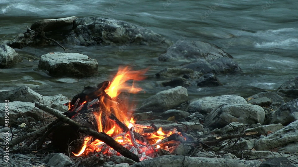 camp fire on the river bank camp fire on the river bank