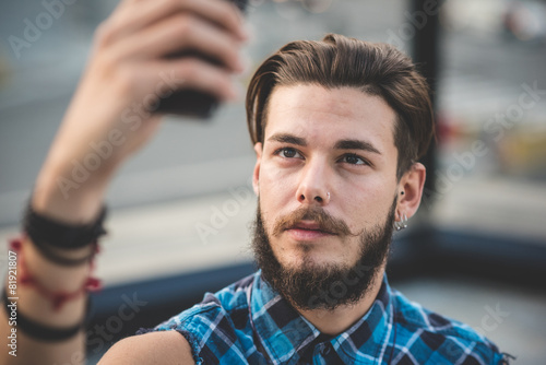 young handsome bearded hipster man selfie