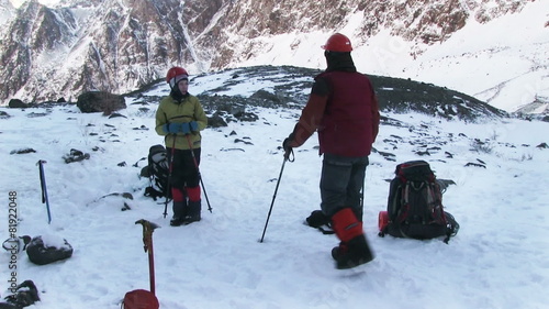 Climber resting on a glacier before climbing to the top of the mountain. Altai, in November 2015, the foot of the mountain Aktru, altitude 4000