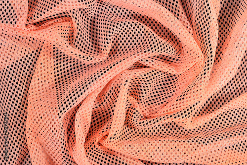 Orange crumpled nonwoven fabric background