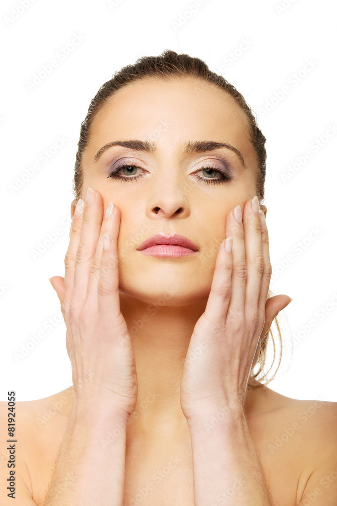 Spa woman with make up touching her face. Spa woman with make up touching her face.