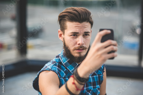 young handsome bearded hipster man selfie