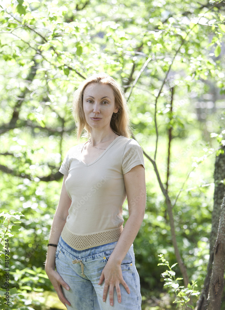 summer portrait of the young attractive woman summer portrait of the young attractive woman