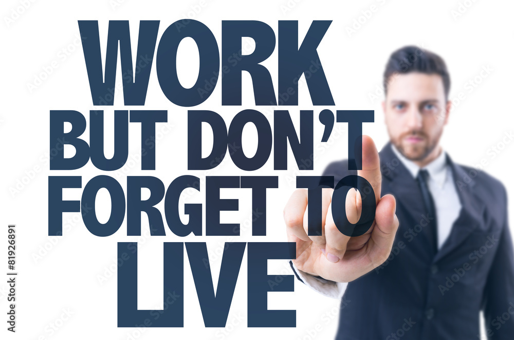 Business man pointing the text: Work But Don't Forget to Live Business man pointing the text: Work But Don't Forget to Live