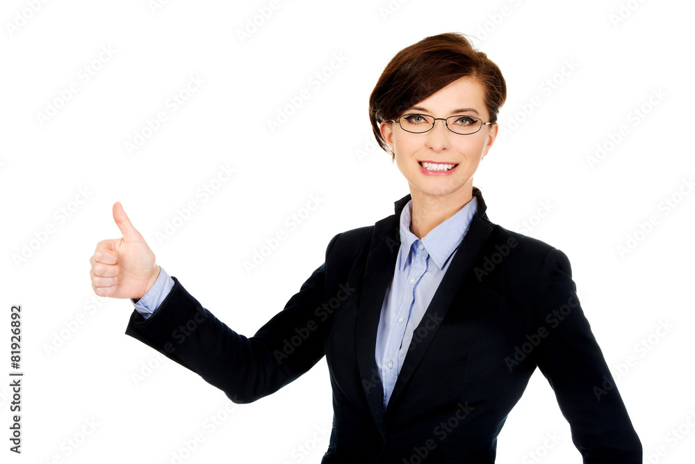 Smiling businesswoman with thumbs up. Smiling businesswoman with thumbs up.