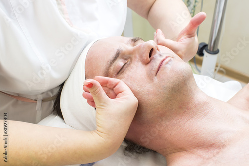 man in a beauty salon facial and massage