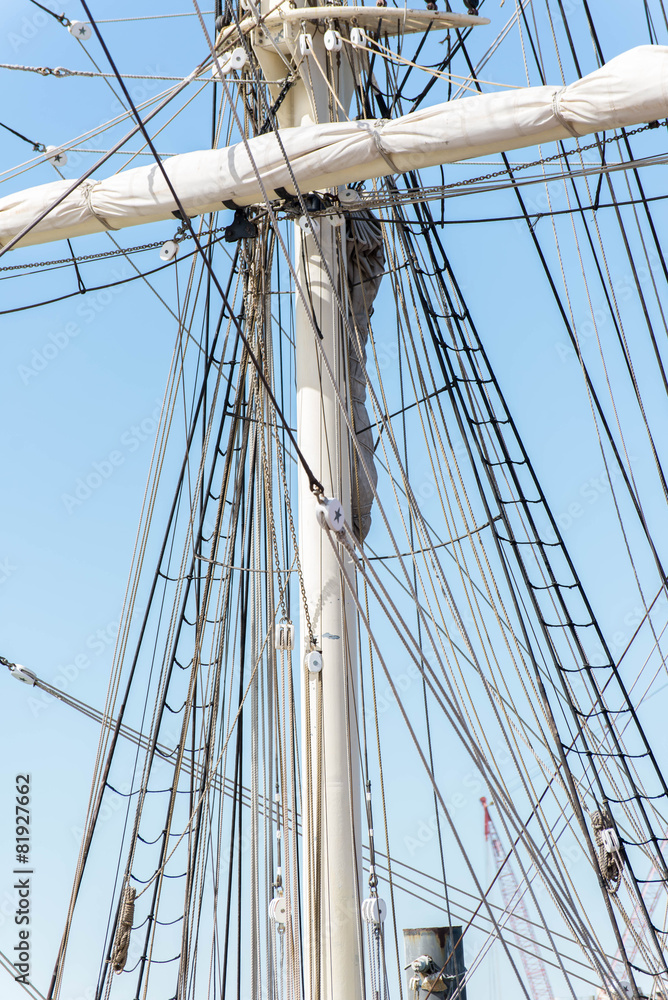 sailboat masts, riggin and rolled up sails sailboat masts, riggin and rolled up sails