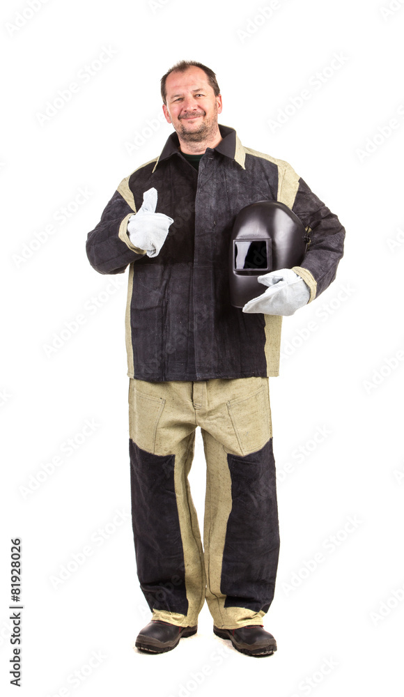 Confident welder with arms on waist. Confident welder with arms on waist.