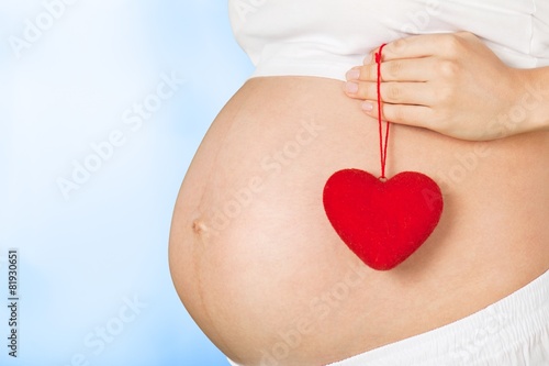 Wallpaper Mural Expecting. Close up on pregnant belly. Woman expecting a baby Torontodigital.ca