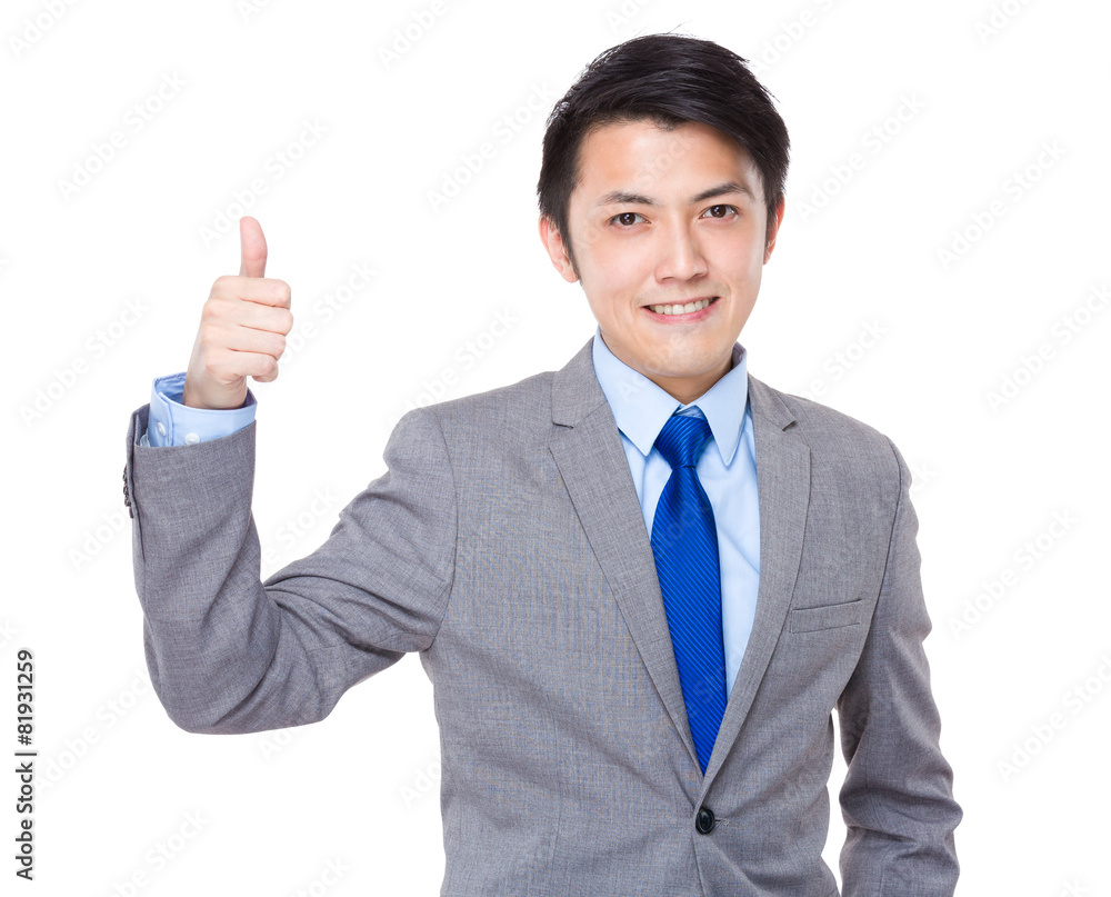 Showing thumb young Asian business man Showing thumb young Asian business man
