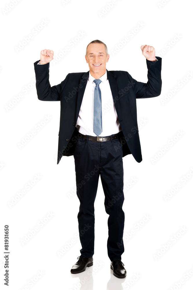 Successful businessman with arms up Successful businessman with arms up