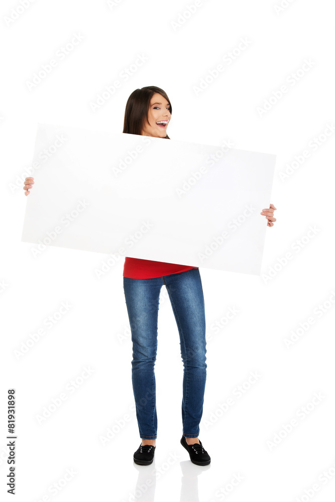 Happy woman holding empty banner. Happy woman holding empty banner.